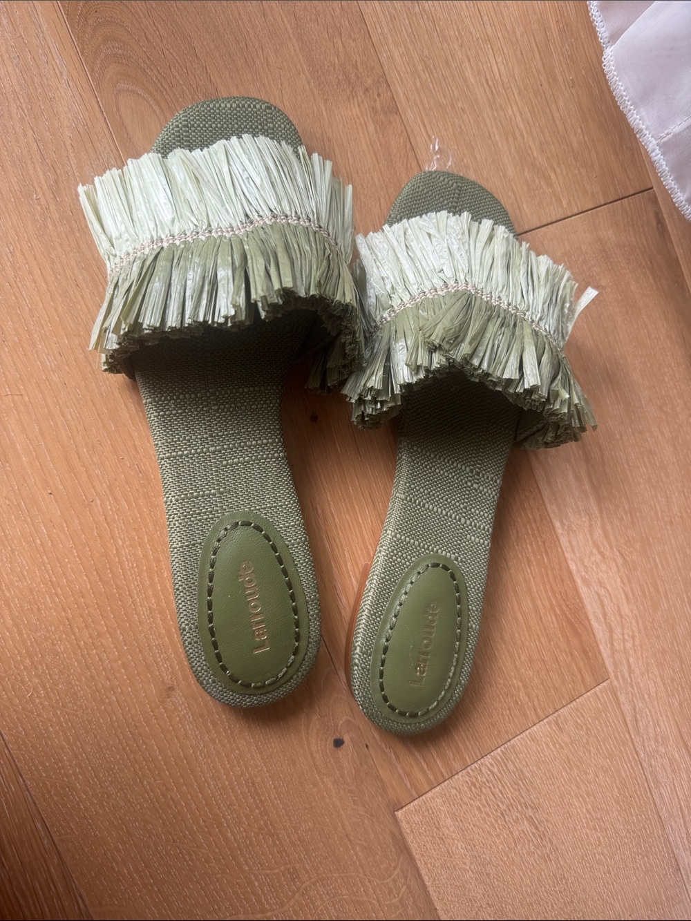 Larroudé Pale Green Raffia Tassel Slip-Ons